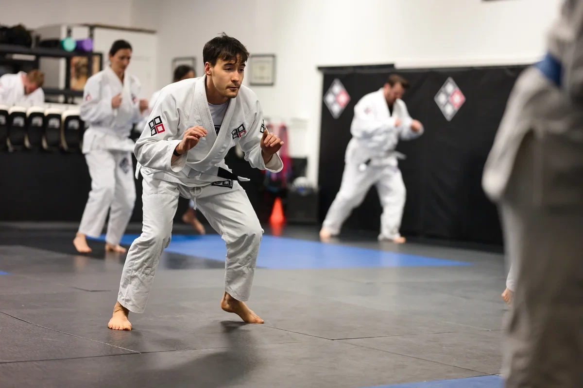 Yorkdale Martial Arts Academy BJJ training floor in York Ontario - students practicing grappling techniques