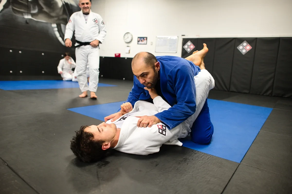 Adult learning BJJ guard pass at Yorkdale Martial Arts Academy in York