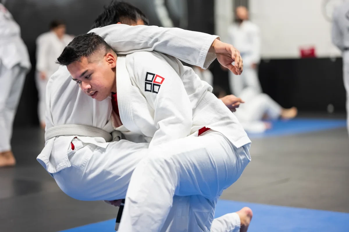 Adult practicing BJJ guard position near Toronto at Yorkdale Martial Arts - defensive techniques