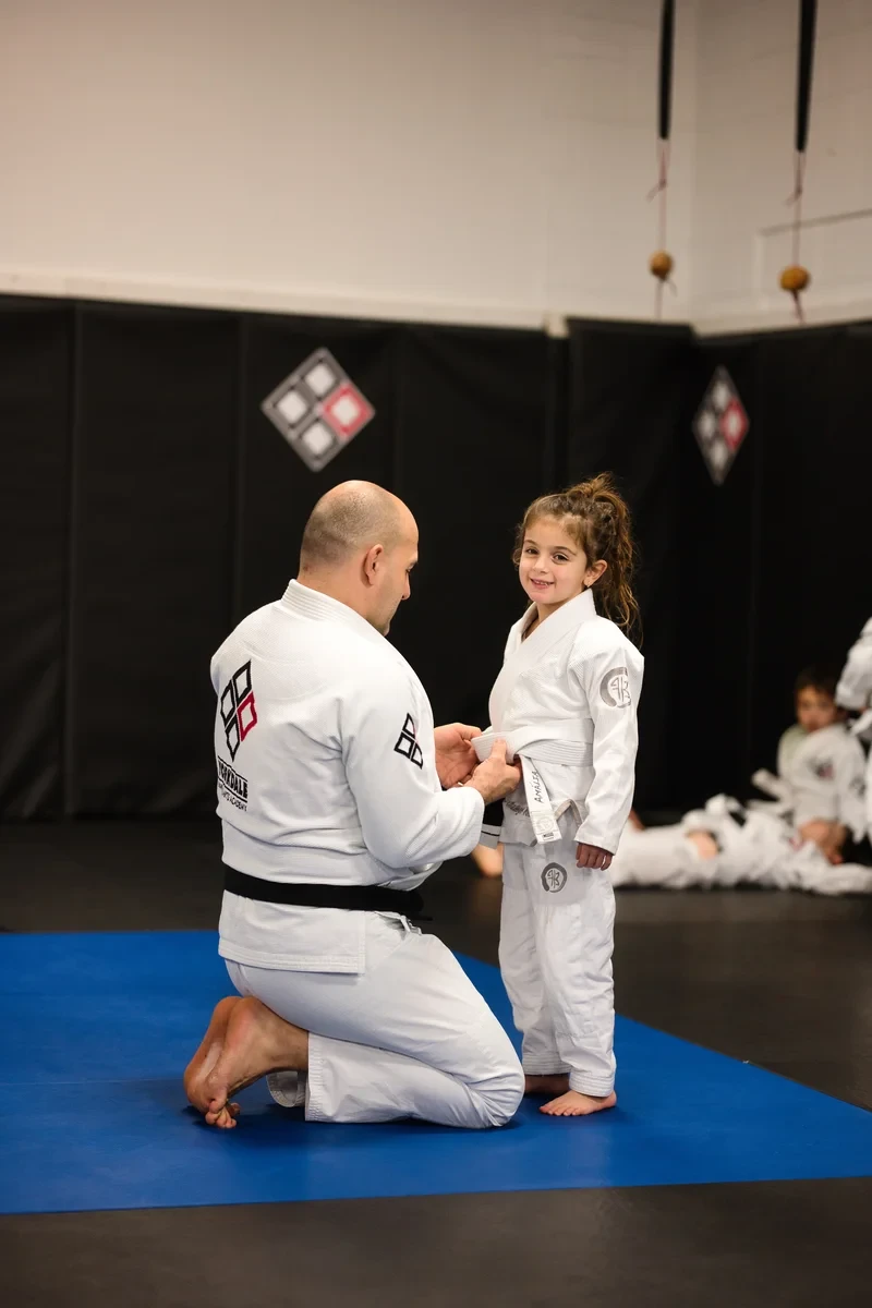 Kids BJJ belt promotion ceremony at Yorkdale Martial Arts Academy serving Toronto families