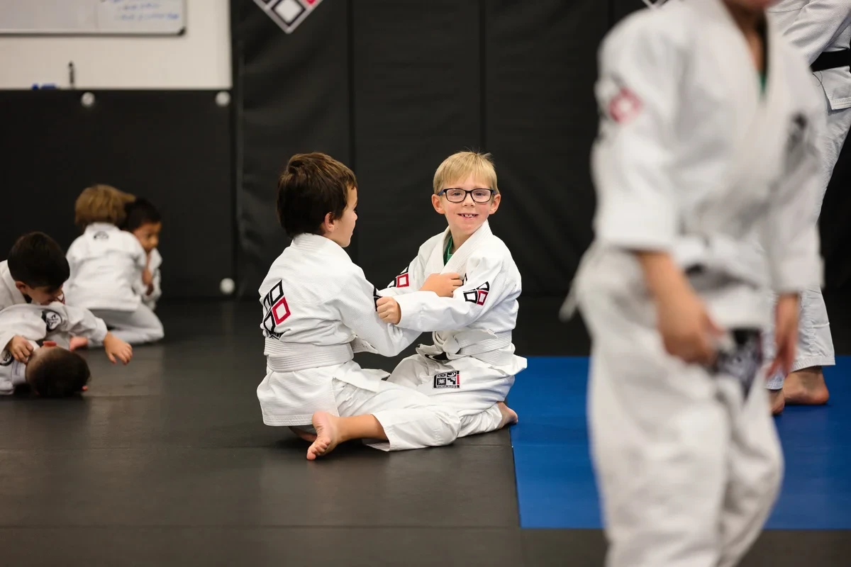 Children practicing BJJ partner drills near Toronto - youth grappling training