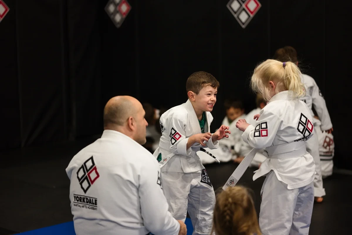 Kids practicing Brazilian Jiu Jitsu techniques at Yorkdale Martial Arts Academy in York Ontario - children learning grappling skills
