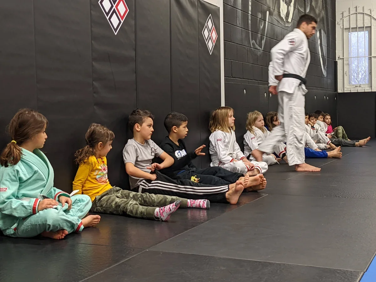 Kids having outdoor fun at martial arts summer camp near Toronto